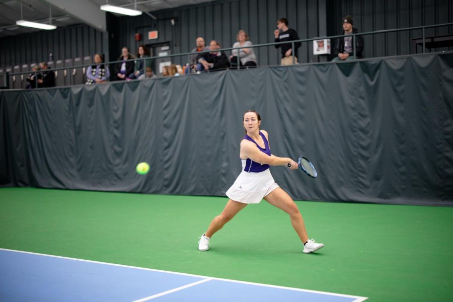 Third-year Sara Anderson competing in a match against Upper Iowa University. The start of the spring semester has brought the beginning of Tennis and other Winona State womens sports like Track and Field, Gymnastics, and Softball.