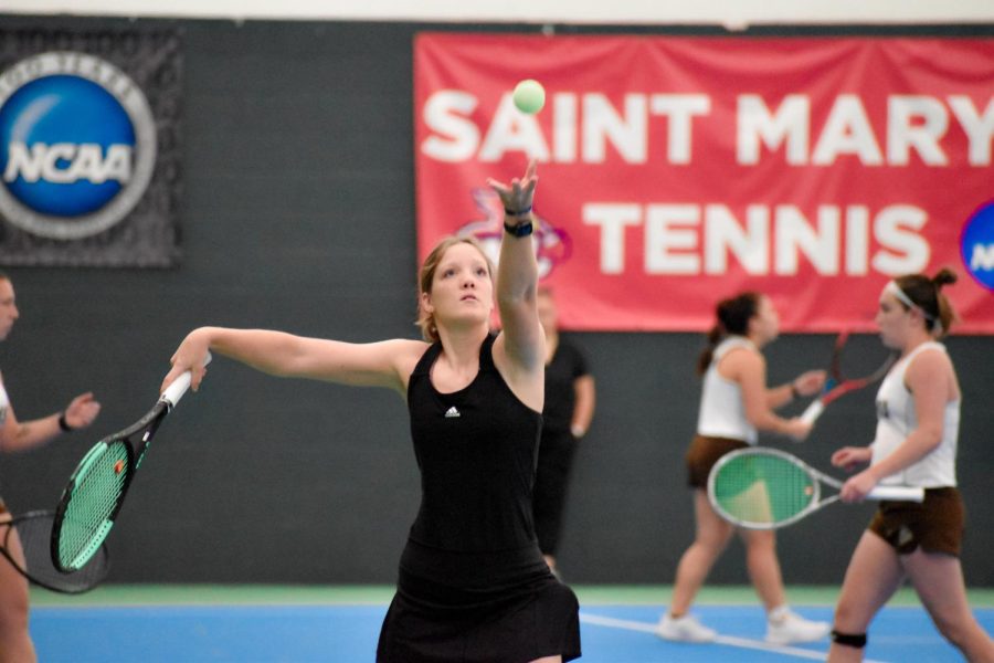 First-year Miranda Daulong serving a ball to her opponent. The womans tennis team fell to Minnesota State University - Mankato with a score of 7 – 0 in their first NSIC match of the season.