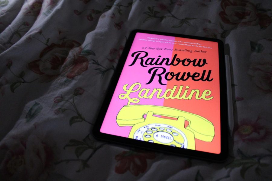 Landline+is+a+2014+sci-fi+novel+written+by+Rainbow+Rowell.+The+book+explores+the+concept+of+a+spouse+being+able+to+call+her+younger+husband+over+the+phone.