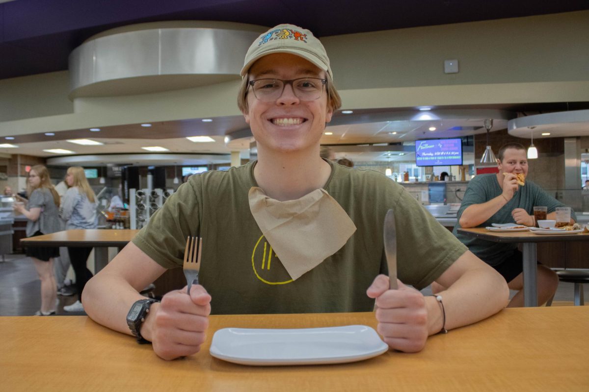 Jake Gifford prepares himself in the journey to try each station at the Jack Kane Dining Hall this past week on September 28th, 2023.