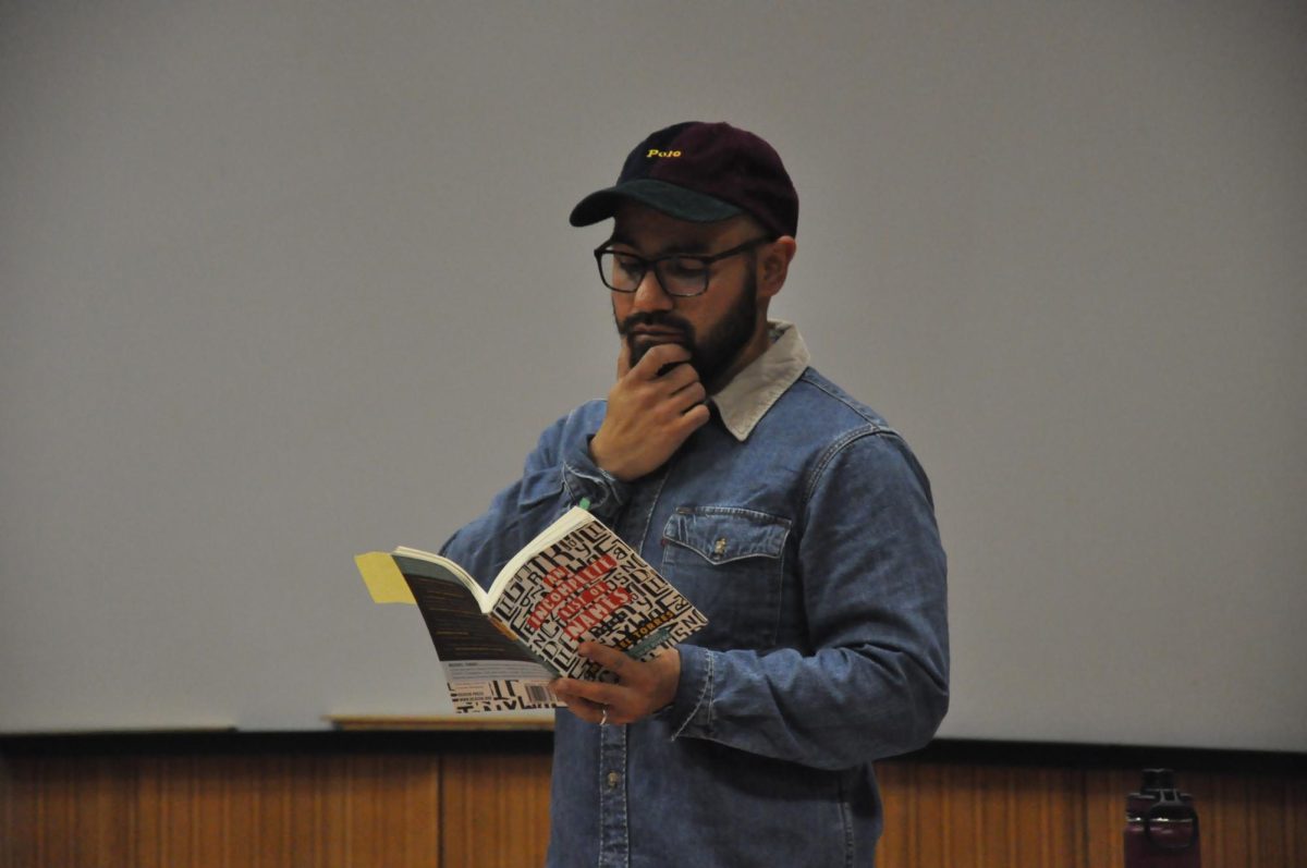Michael Torres begins his reading with his favorite poem, “All American Mexican” from his book “An incomplete List of Names”.