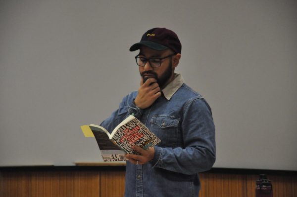 Michael Torres begins his reading with his favorite poem, “All American Mexican” from his book “An incomplete List of Names”.