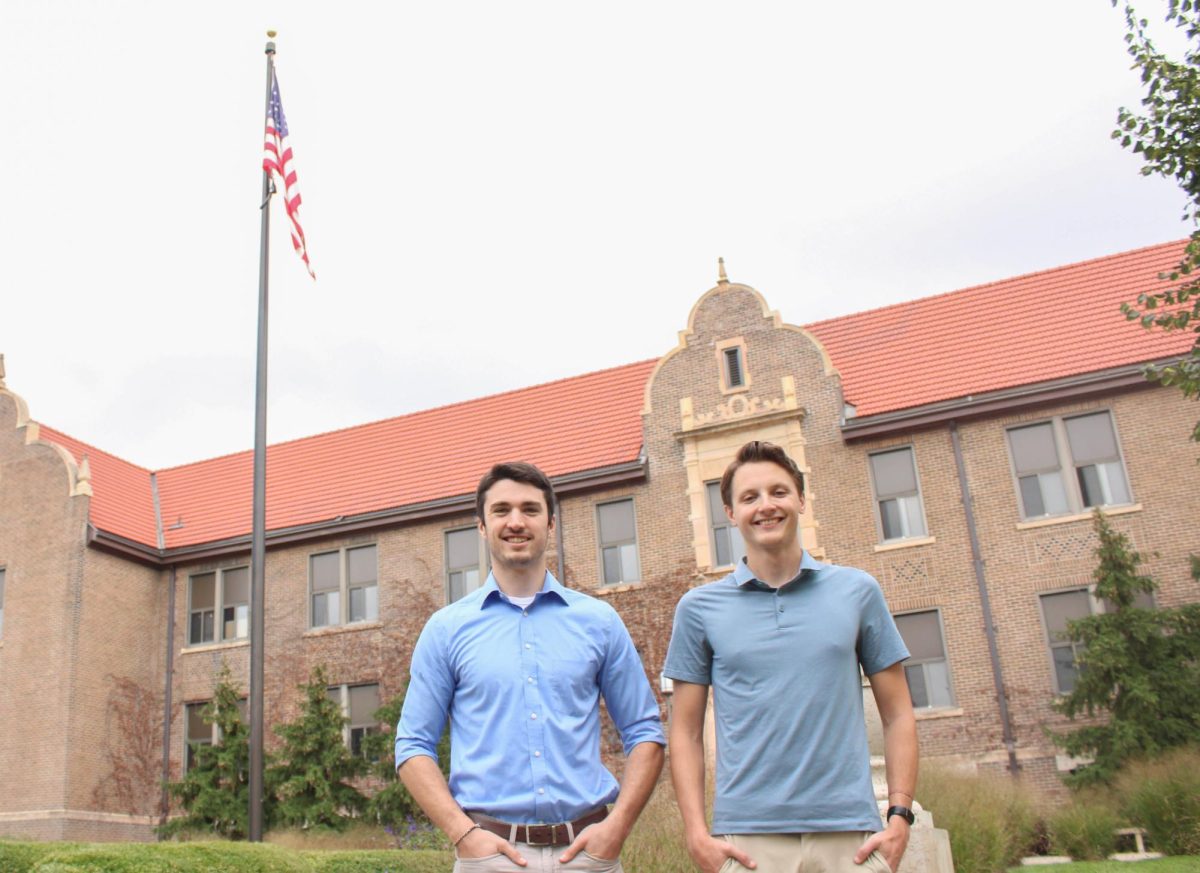 Co-Presidents of the College Republicans Jason Hoeft and
Samuel Persche in front of the American Flag.