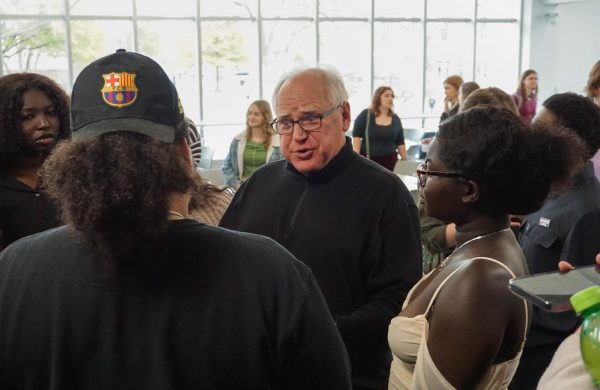 Minnesota’s governor, Tim Walz, talks with students in the Solarium.