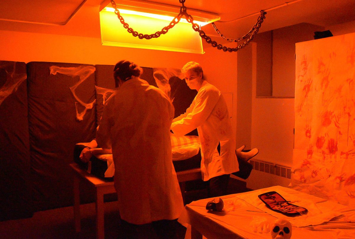 The first room of the haunted floor. Two doctors performing on a patient 