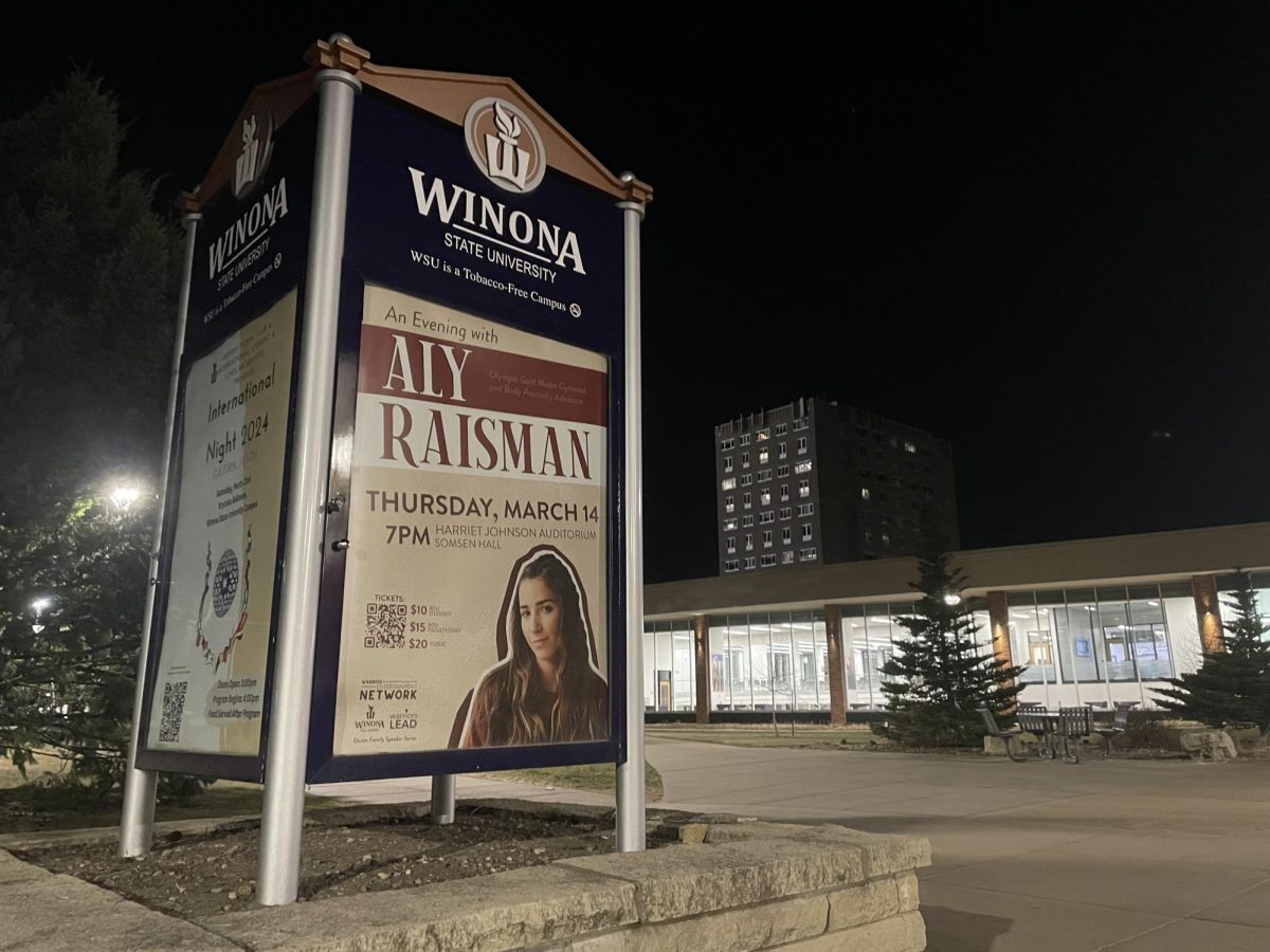 Outside of Kryzsko Commons, an advertisement for Aly Raisman’s event is shown. A fourth-year student at Winona State University and also a gymnastics Olympian.
