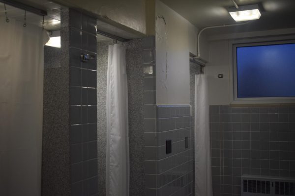 Some showers in residence halls at WSU are only divided by curtains, causing students to question security.