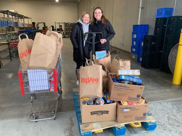 Rose Cases and Haley Mulberry worked to collect over 500 food items for the Winona Volunteer Services food shelf.