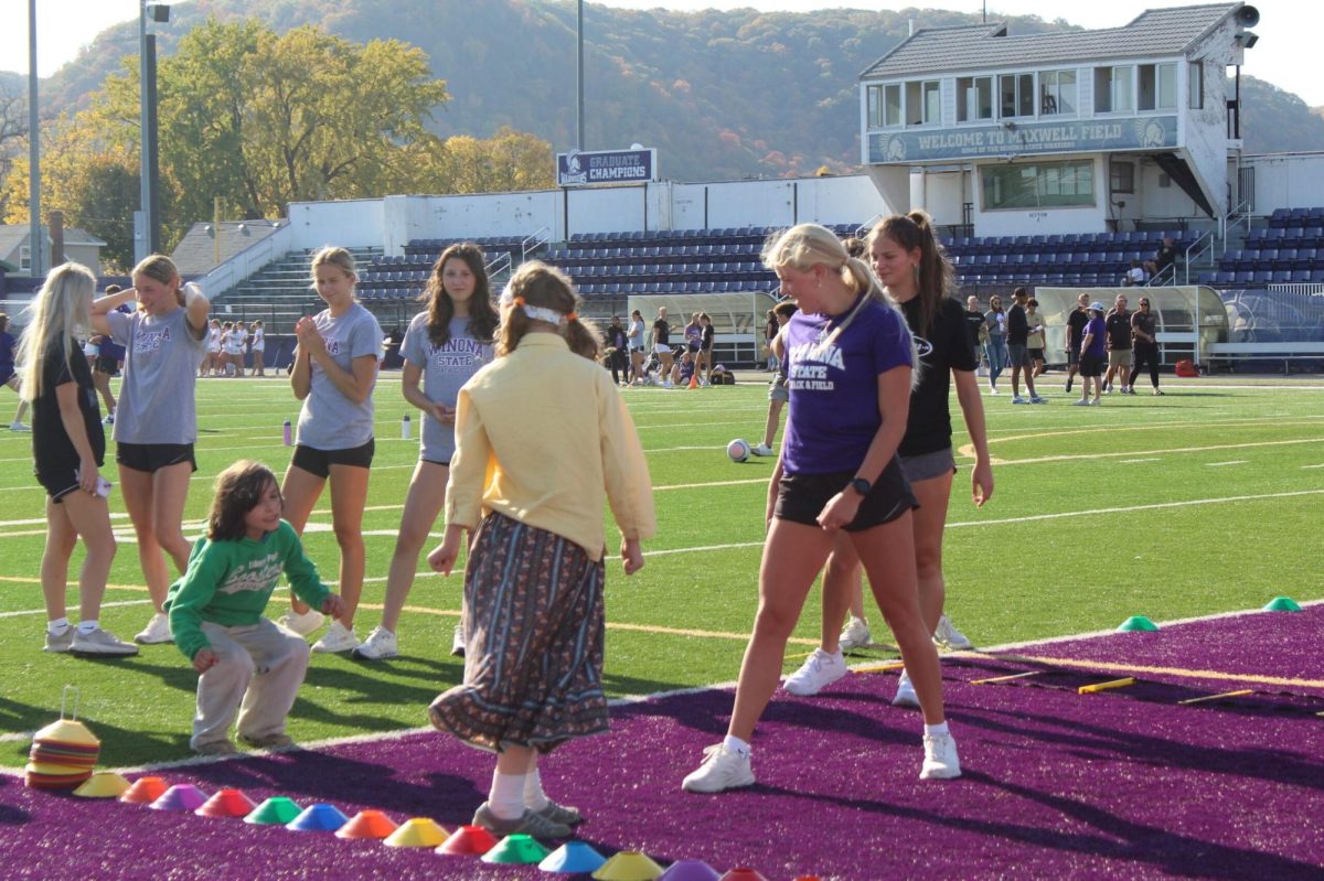 With the sun beaming down on Winona State University’s football stadium, groups of student athletes form a variety of different sports showed their support at the annual Zombie Crawl event on Oct. 20.  