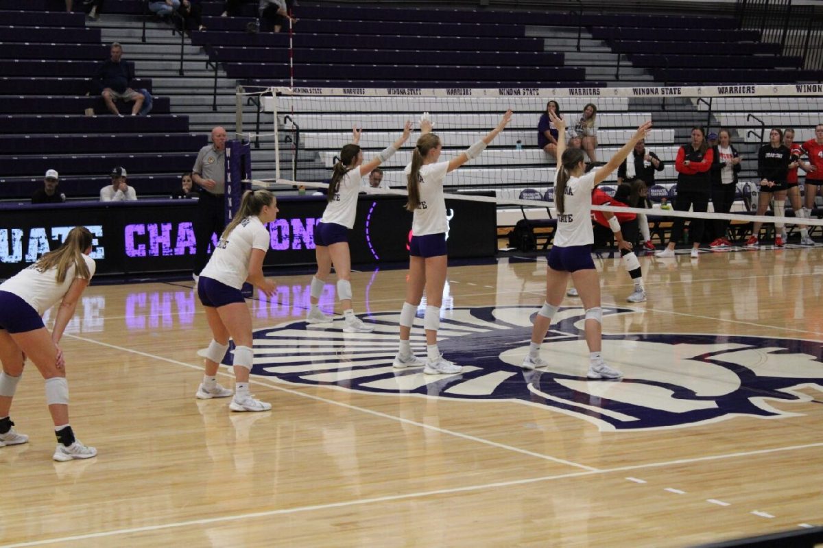 The Winona State Volleyball team gets into their defensive positions.