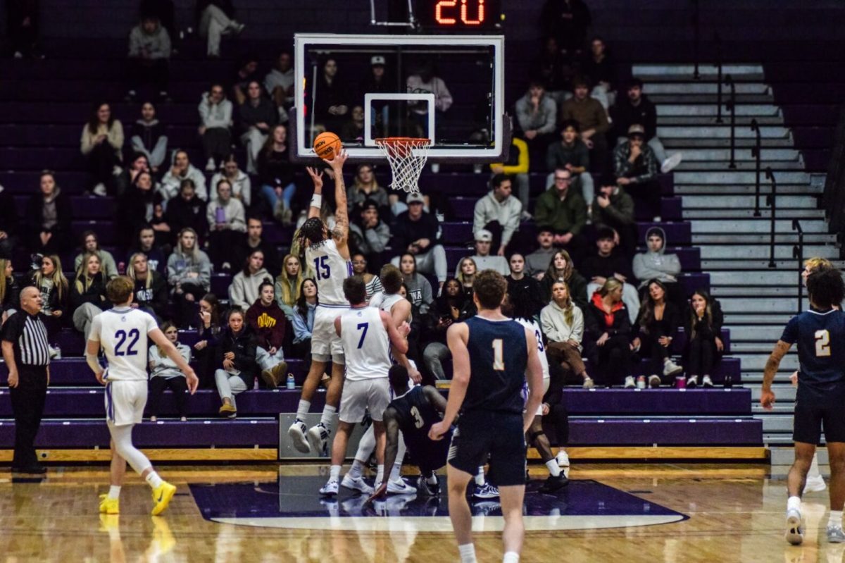 Isaiah Thompson (15) goes to tack another point onto the Warriors scoreboard.