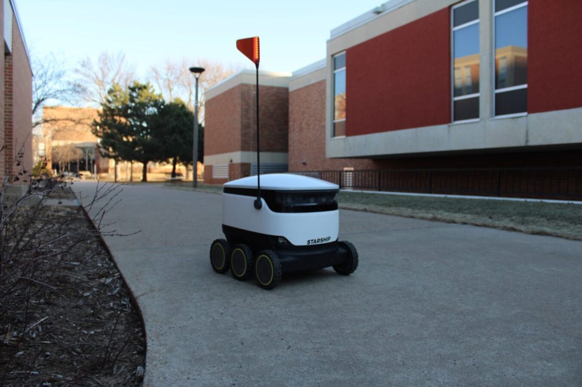 One of the new little robots rides along the pathways of Winona State, heading to its next food delivery on campus.