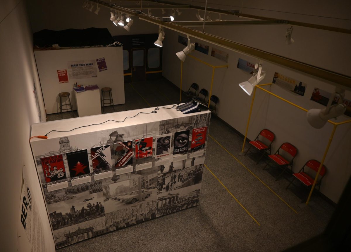 Watkins gallery sits as artwork comes and goes from it’s white walls. From the second level, all three projects done by students on the study aboard trip, “Berlin: Shifting the Paradigm”. While all exhibits can be seen, the most prominent one being “Concrete & Culture” done by Thea McAdams, Maya Laudierdale, Meghan Cooper and Kaia Peterson.