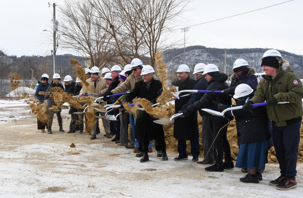 Community and staff bundled together and stood at the corner of Mark and Main Street in a patch of dirt to watch the groundbreaking of Foundation Hall, a soon-to-be built residence hall. 