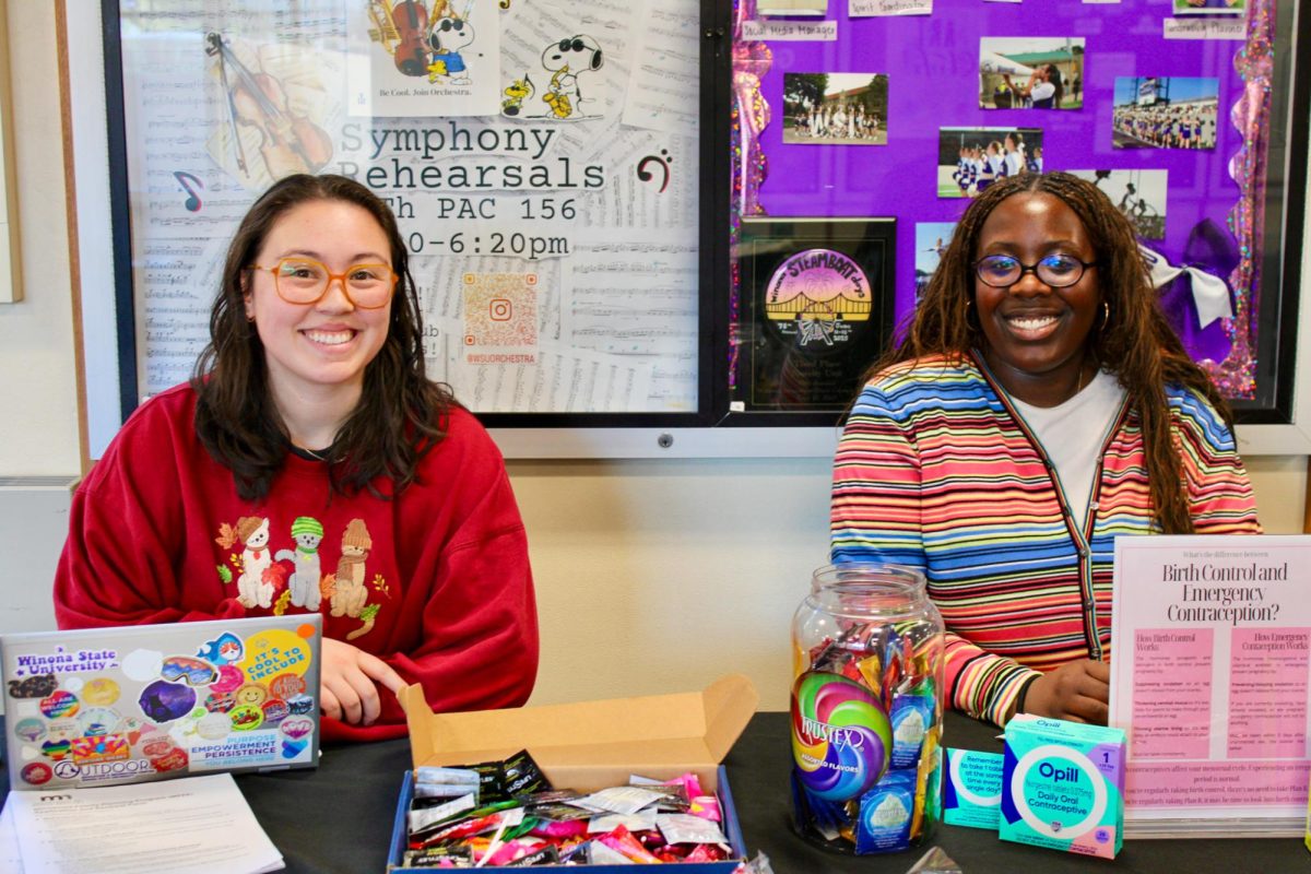 Lexi Yanta-Green and Karina Kpahn (left to right) at their birth control stand further educating students on sexual health while supplying them with things such as Plan B, condoms, and information pamphlets. 
