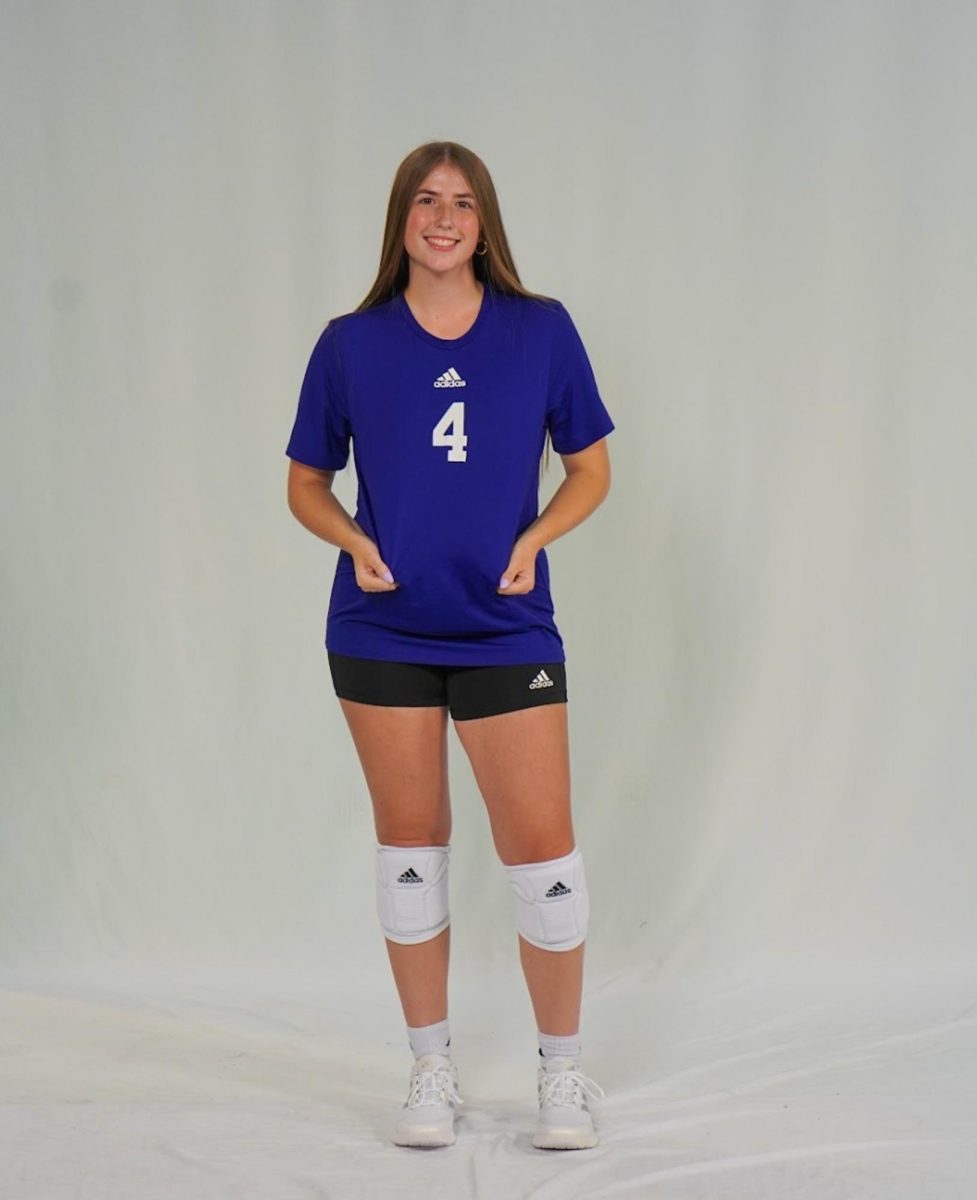 Apel, dressed in the purple Warrior uniform, during 2025 Media Day for the Winona State Volleyball team. 
