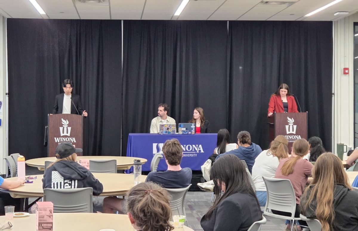 Suho Han and Brooklyn Bothe in a presidential student senate debate. 